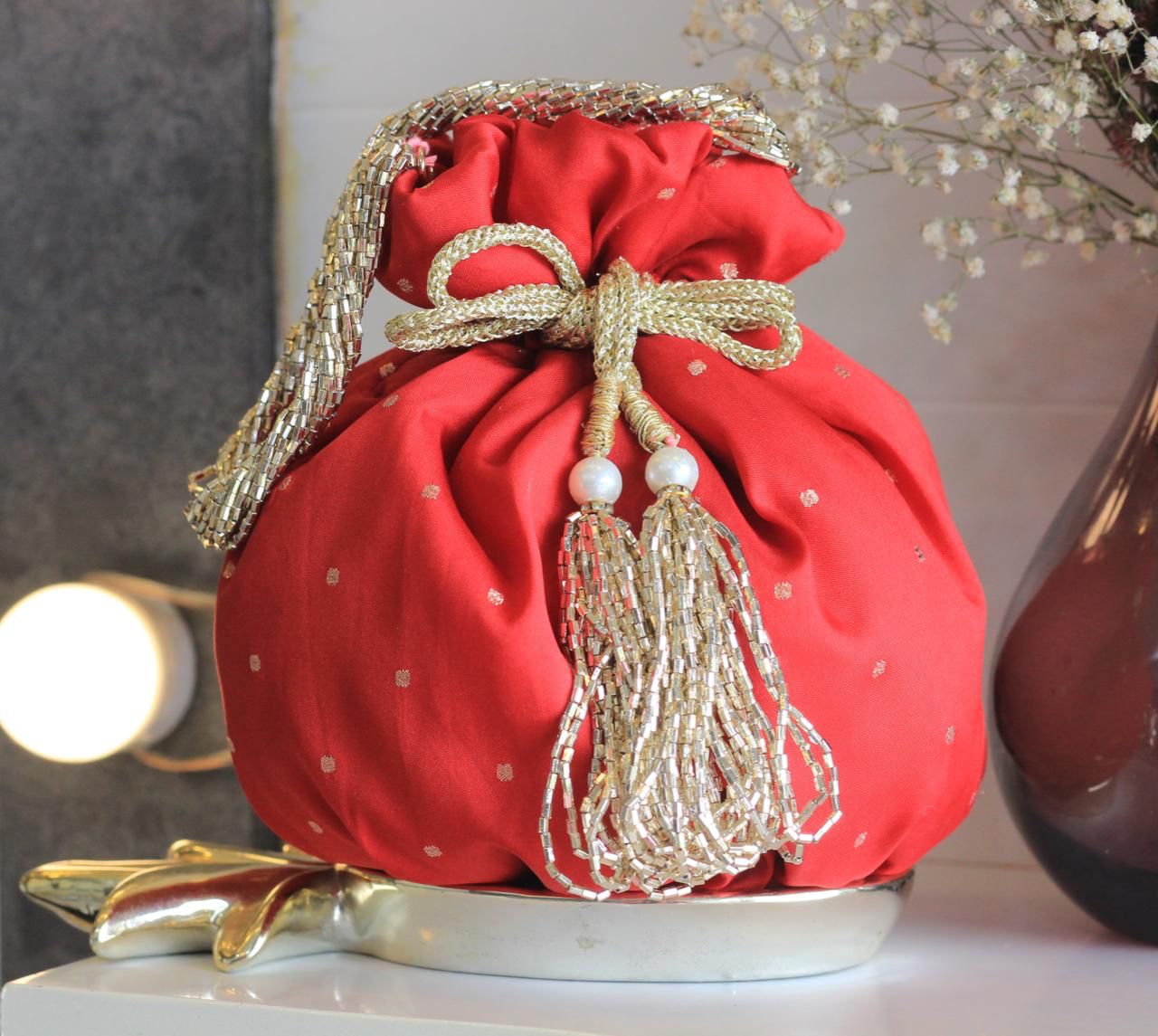 Shimmer matka potlis with pearl handle