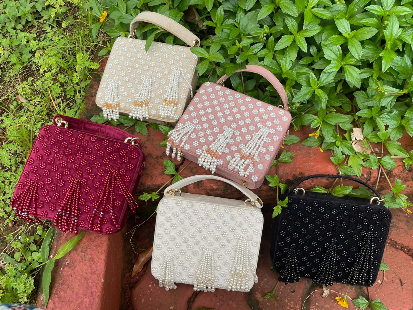 Suede suitcase handbag with hanging pearls