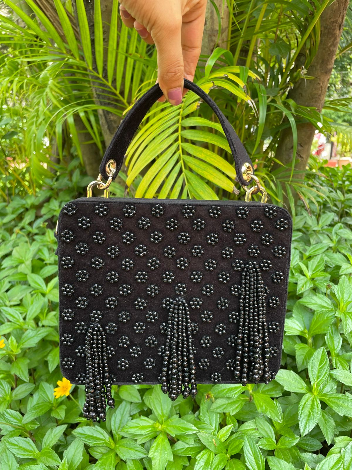 Suede suitcase handbag with hanging pearls