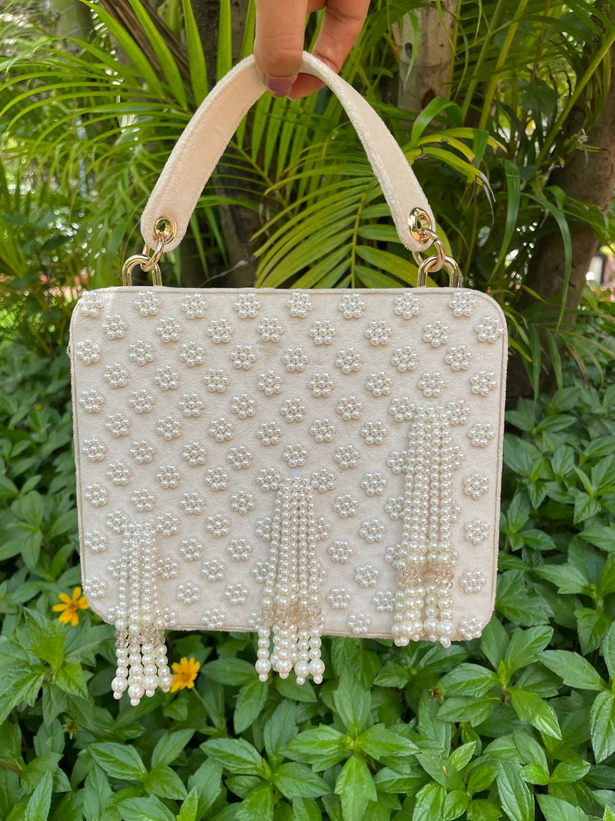 Suede suitcase handbag with hanging pearls