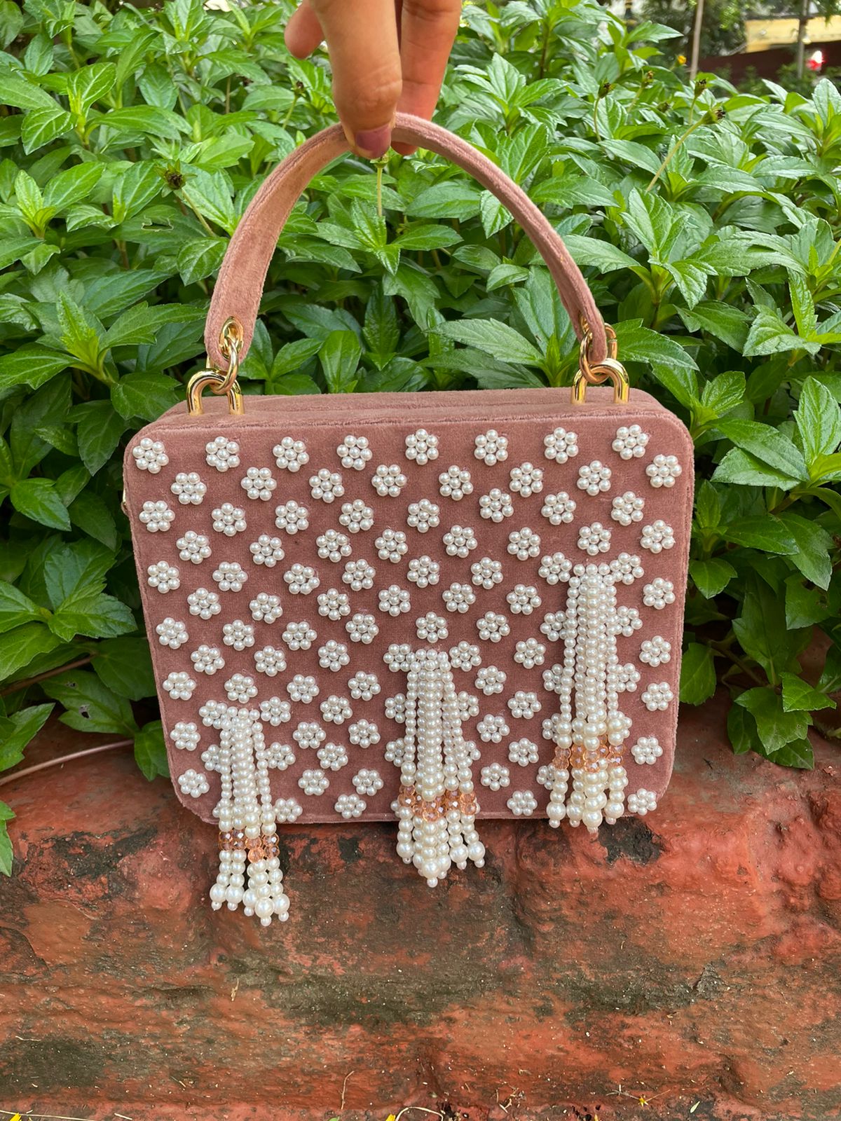 Suede suitcase handbag with hanging pearls