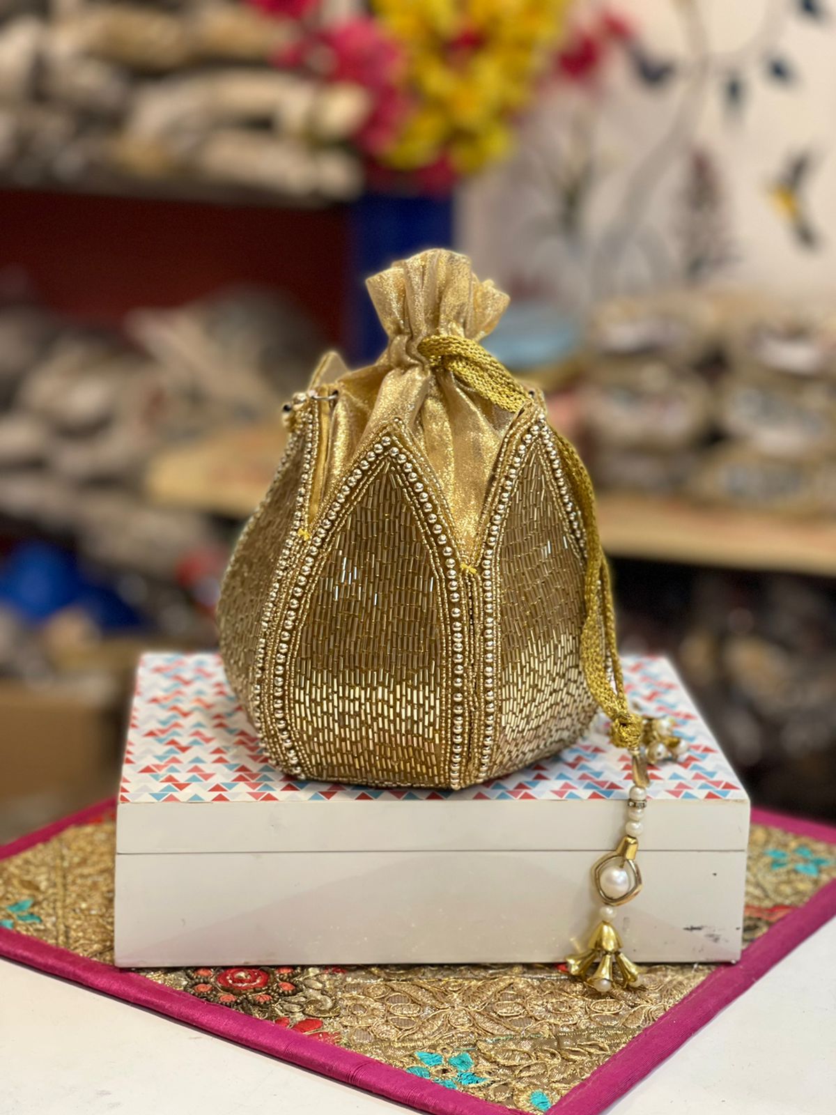 Lotus shape GOLDEN potli with kundan work