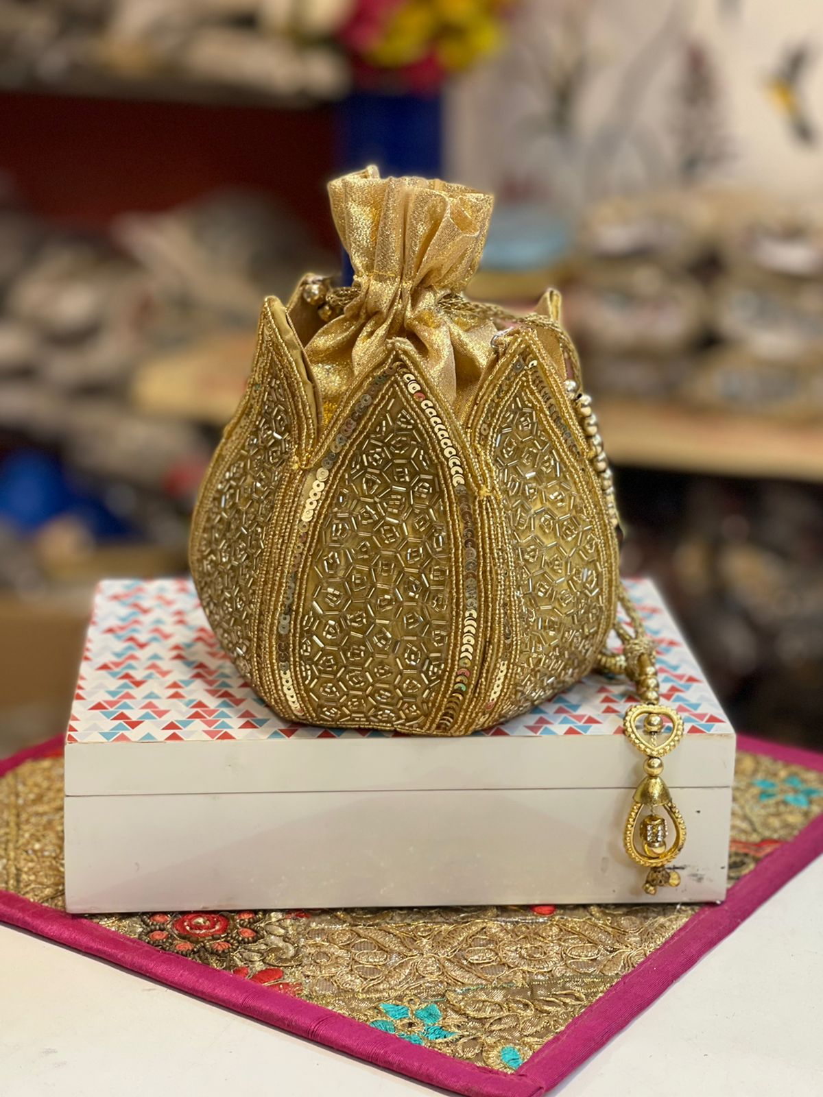 Lotus shape GOLDEN potli with kundan work