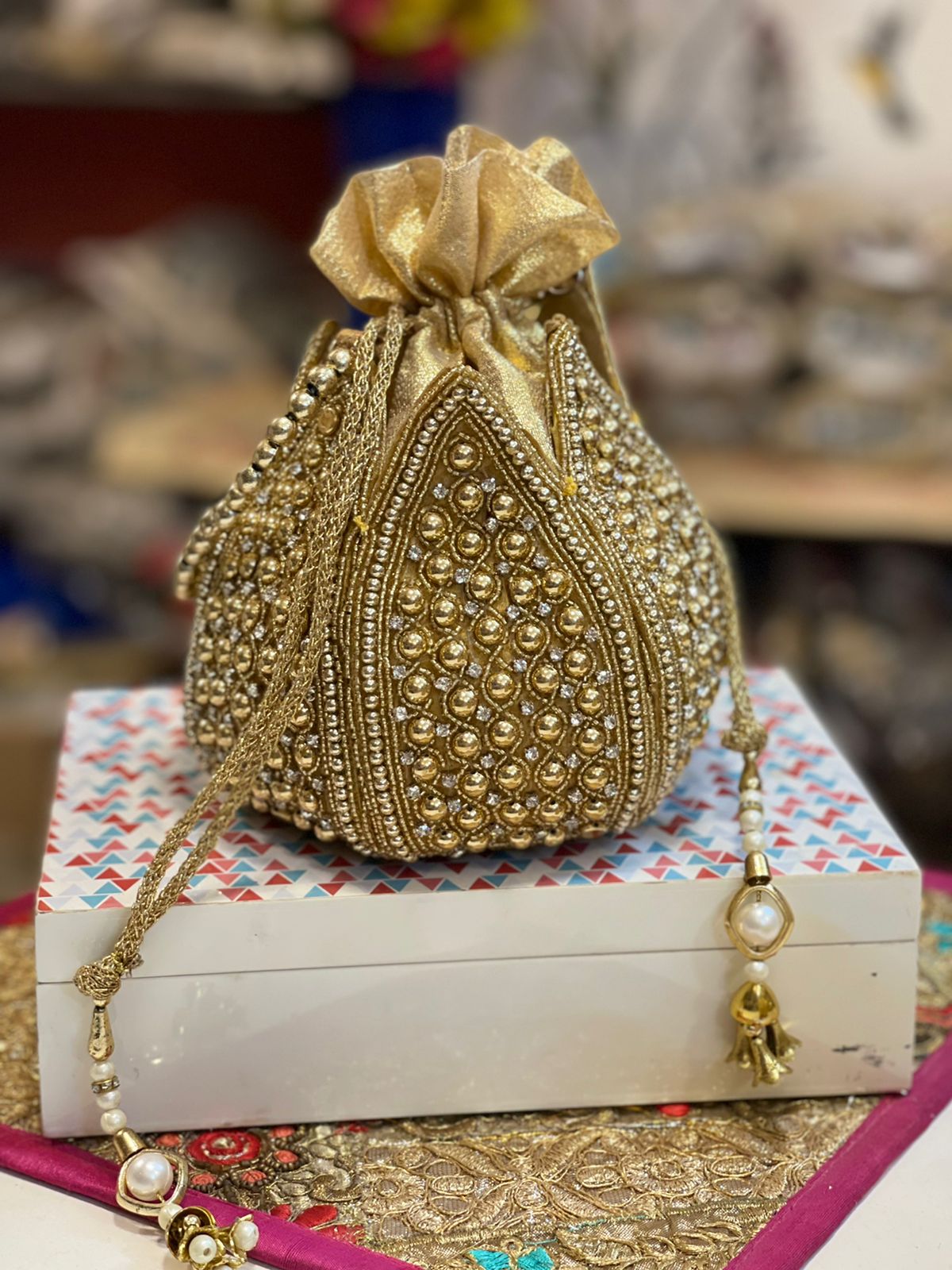 Lotus shape GOLDEN potli with kundan work