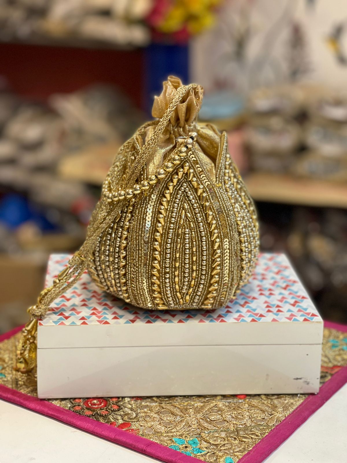 Lotus shape GOLDEN potli with kundan work