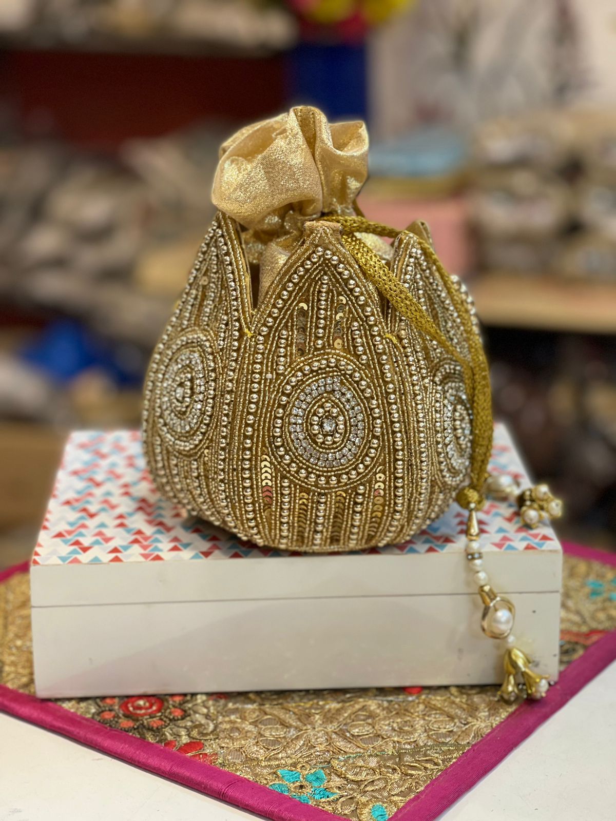 Lotus shape GOLDEN potli with kundan work