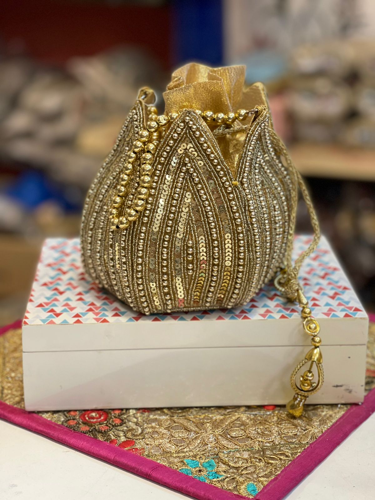 Lotus shape GOLDEN potli with kundan work