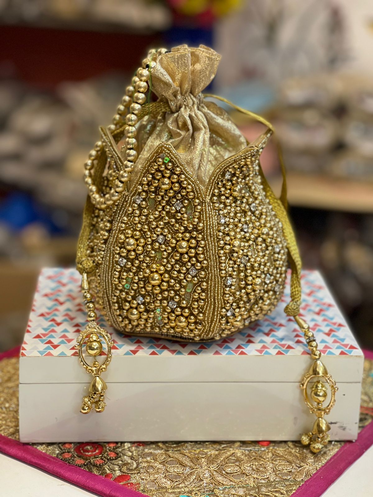 Lotus shape GOLDEN potli with kundan work