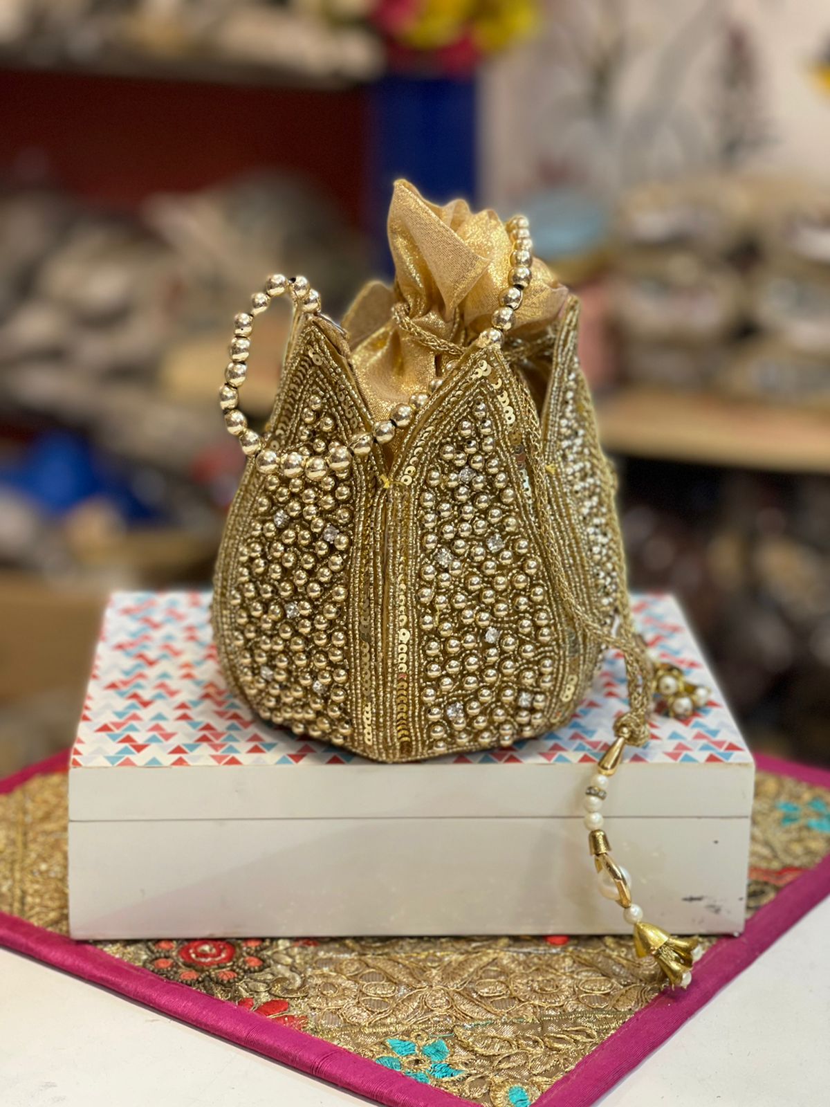 Lotus shape GOLDEN potli with kundan work
