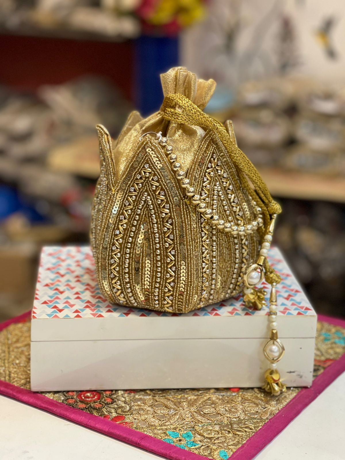 Lotus shape GOLDEN potli with kundan work