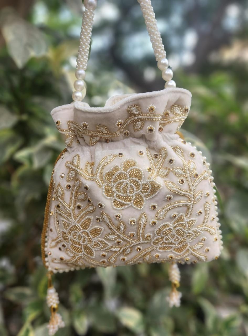 Hand embroidered pearl work potli bag
