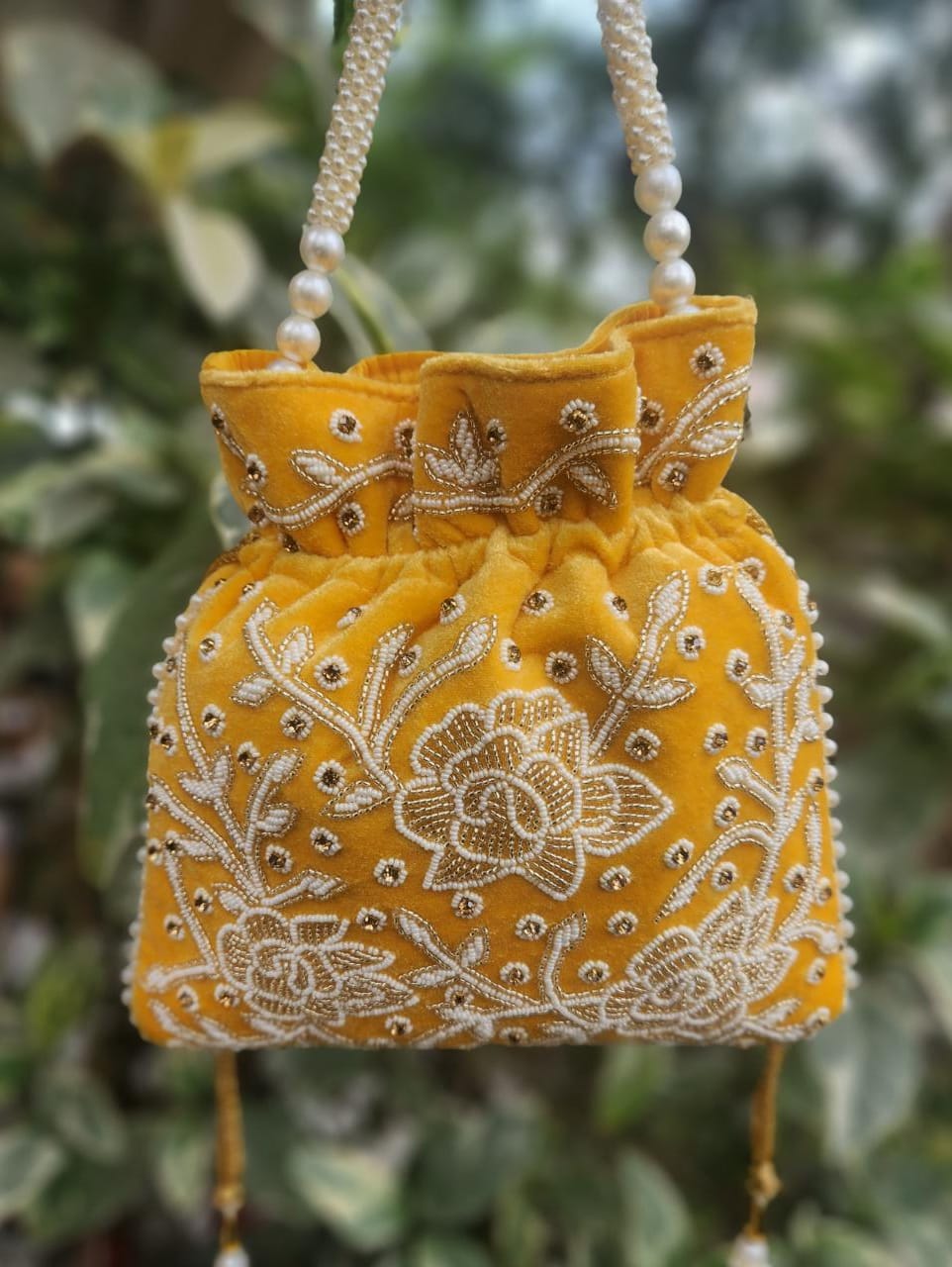 Hand embroidered pearl work potli bag