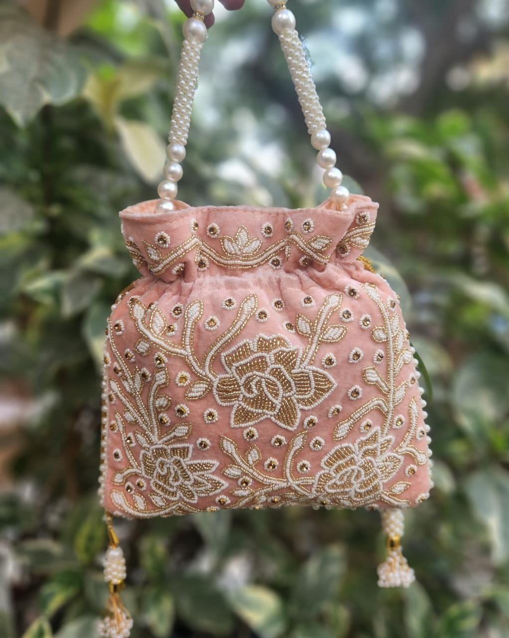 Hand embroidered pearl work potli bag