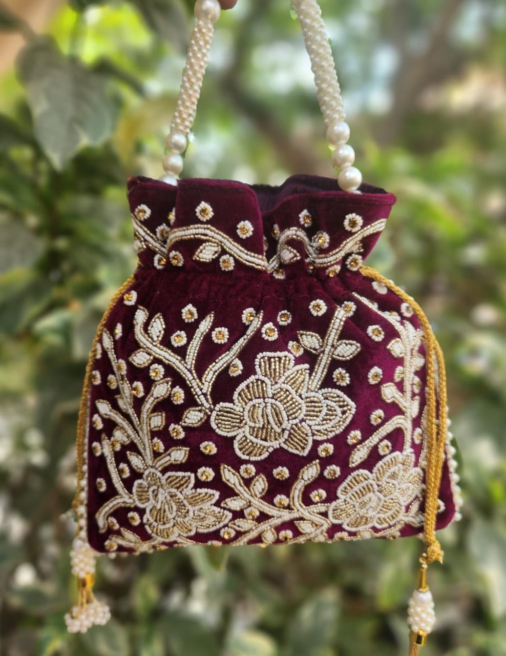 Hand embroidered pearl work potli bag