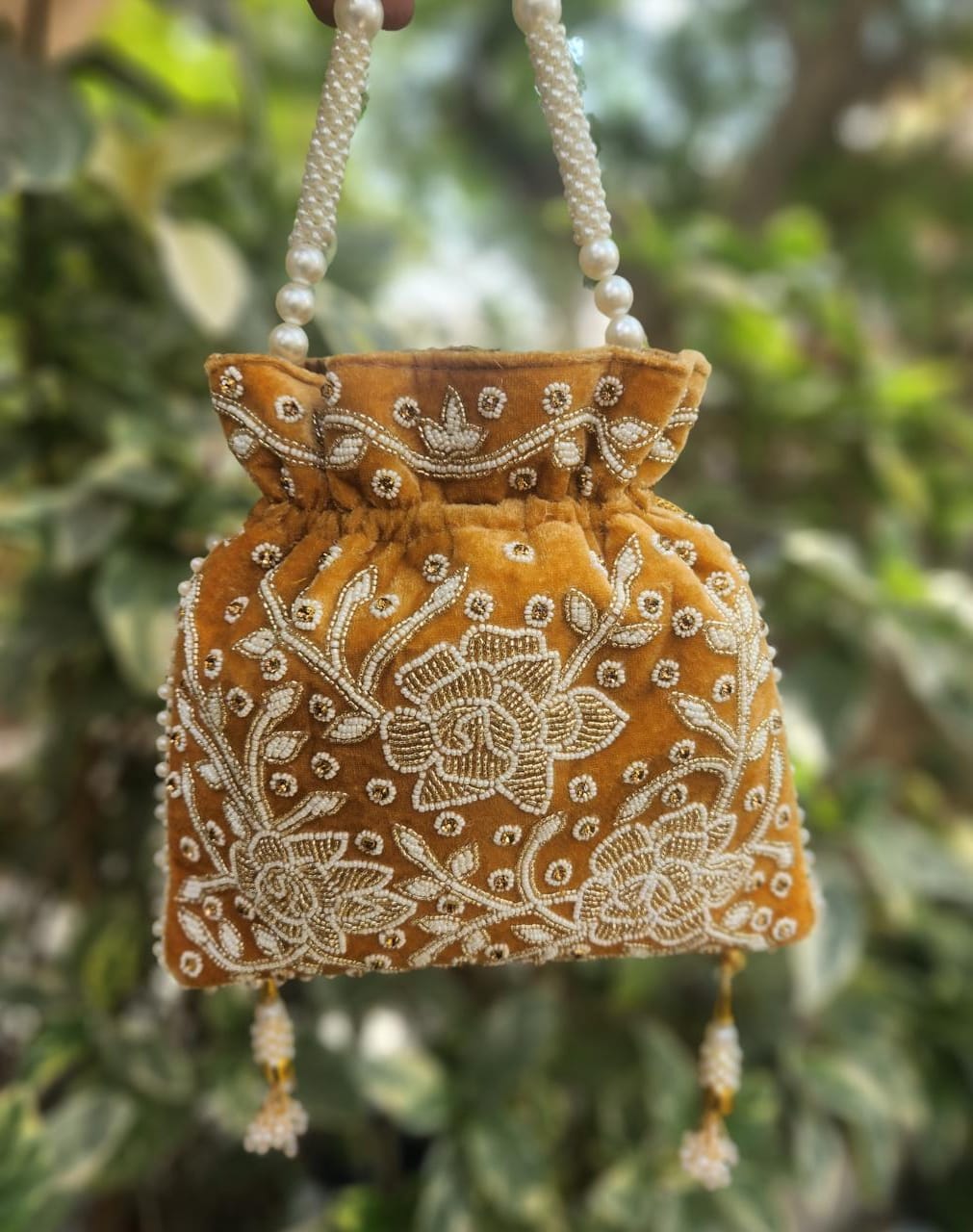Hand embroidered pearl work potli bag