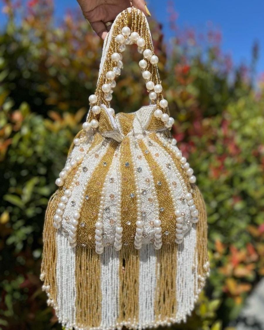 Golden white potli bag with pearl work – Crafty Clutchz The