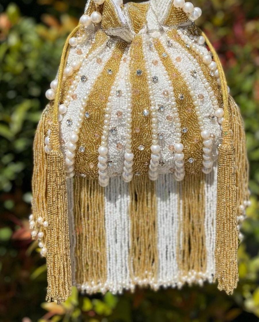 Golden & white potli bag with pearl work