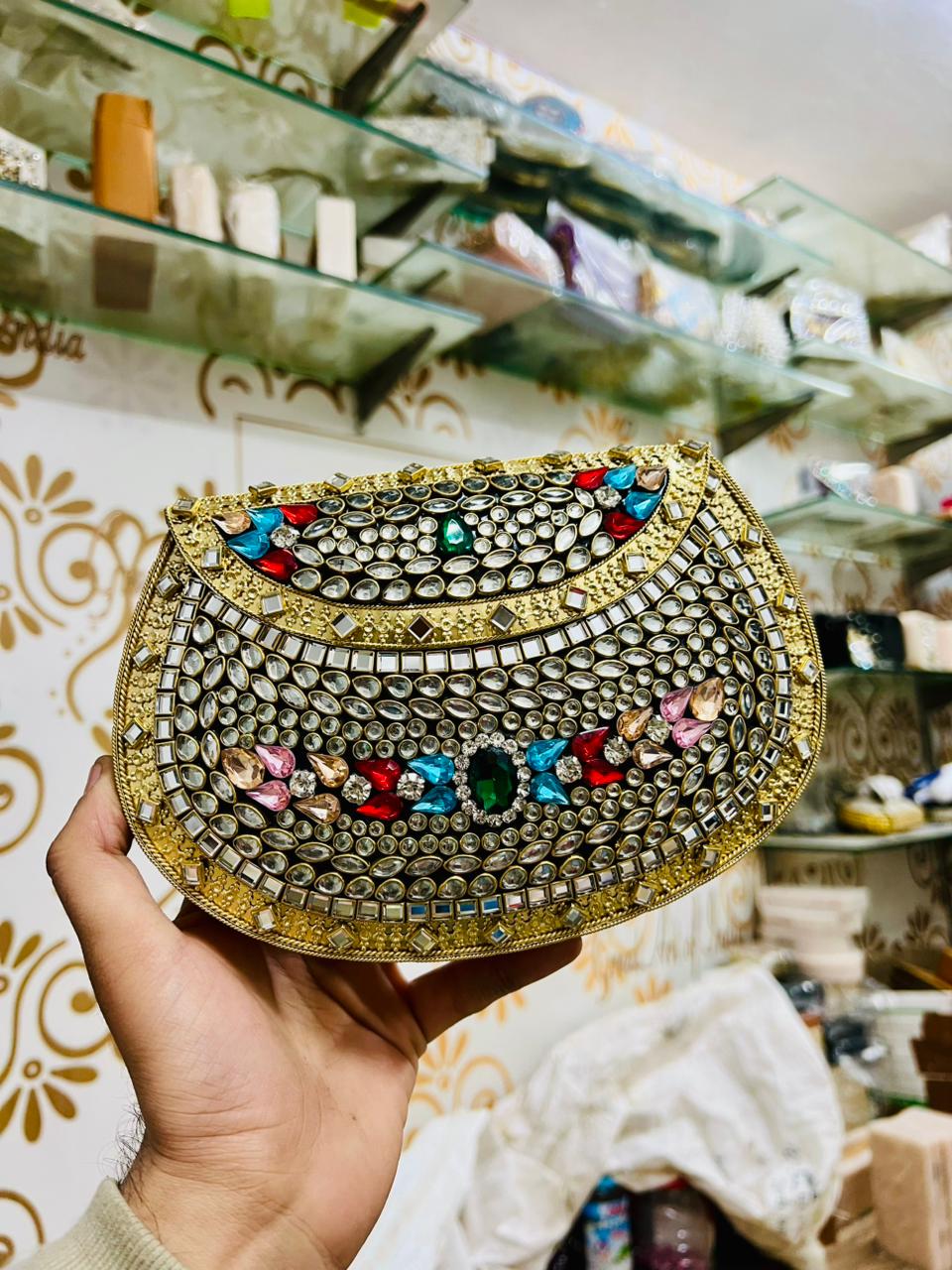Riwaayat rhinestone kundan work brass clutch