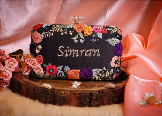 Black floral customised handwork on printed clutch