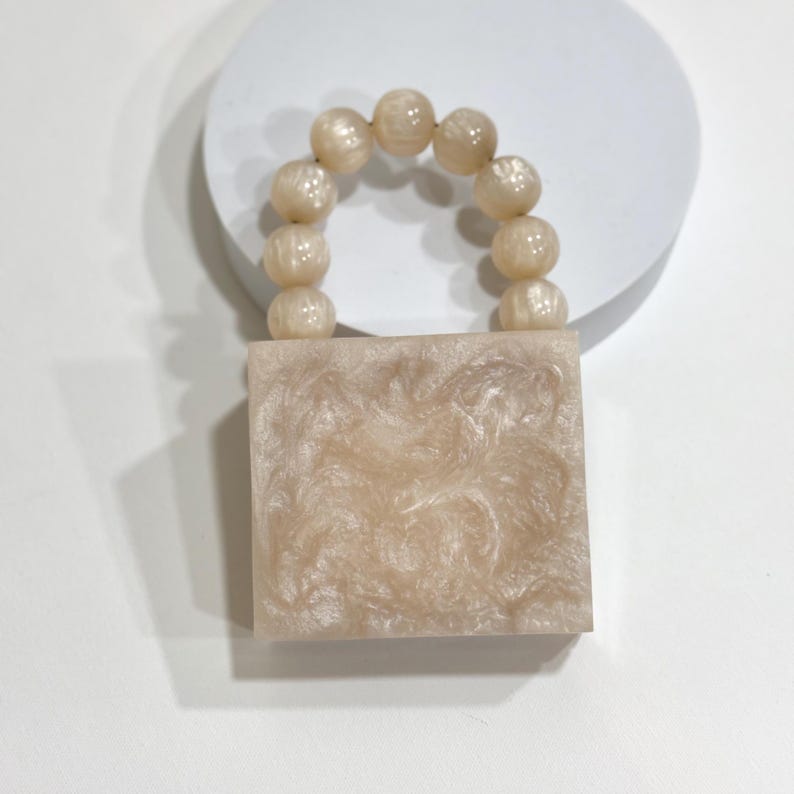 MINI off white  resin clutch with pearl handle