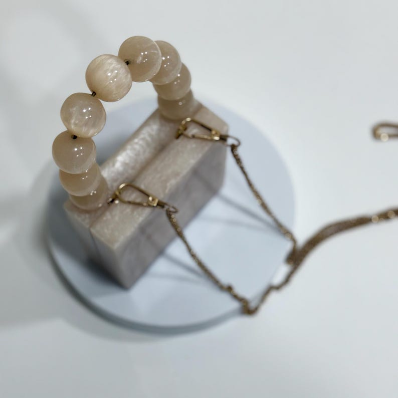 MINI off white  resin clutch with pearl handle