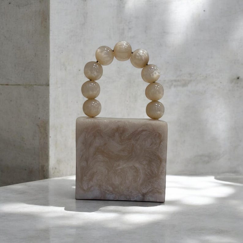 MINI off white  resin clutch with pearl handle