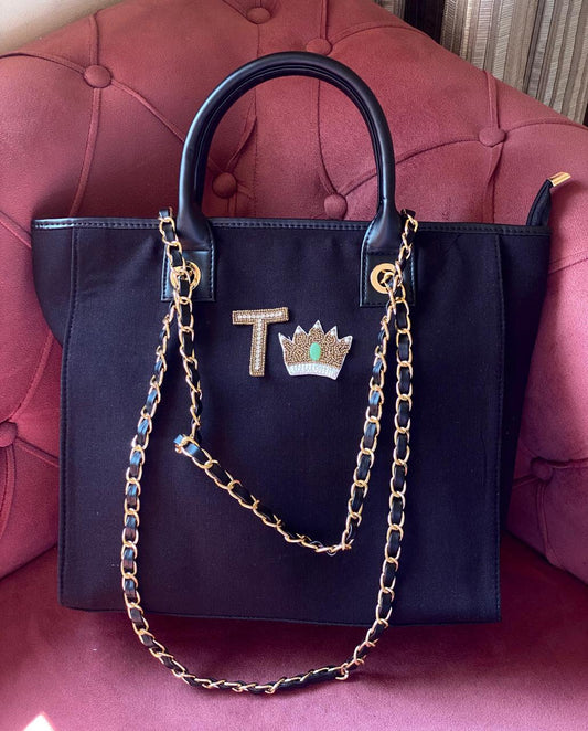 Black canvas tote bag with Crown charm