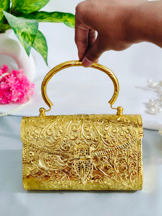 Golden color brass clutch with handle