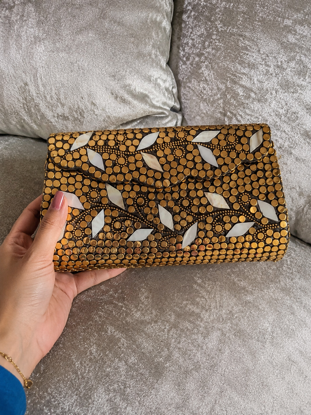 Golden metal clutch with sling