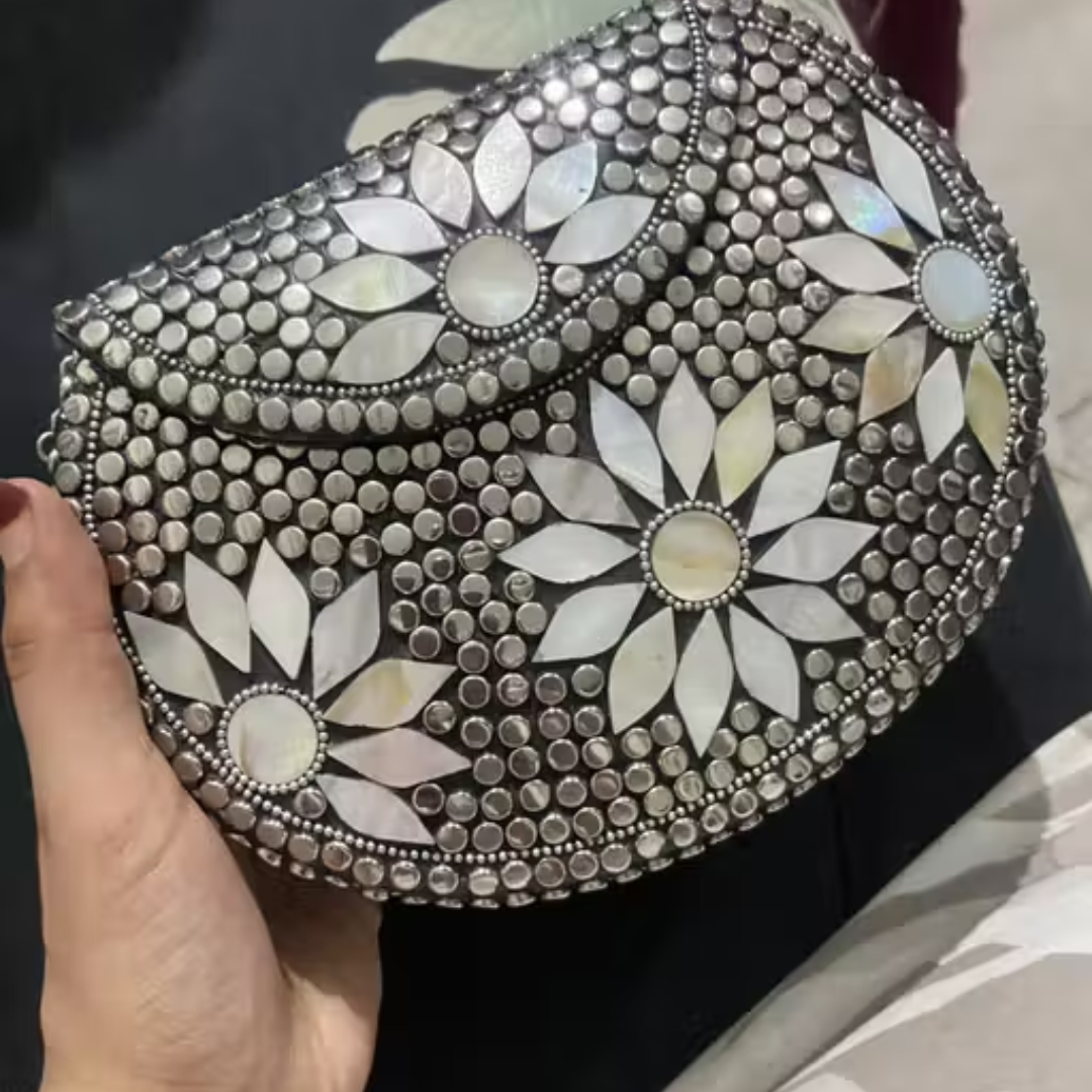 Silver metal clutch with sling