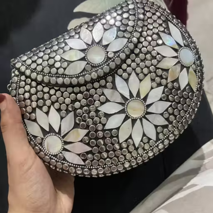 Silver metal clutch with sling