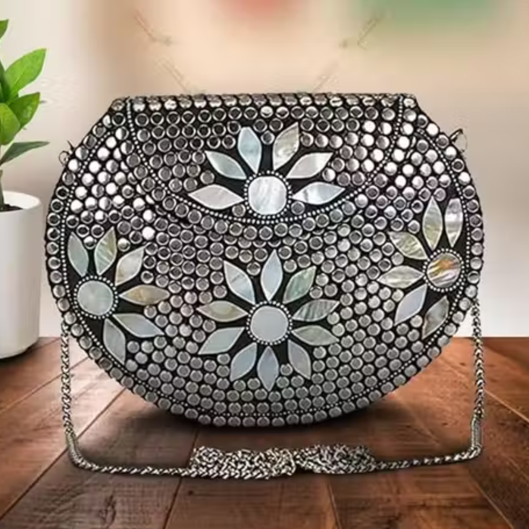 Silver metal clutch with sling