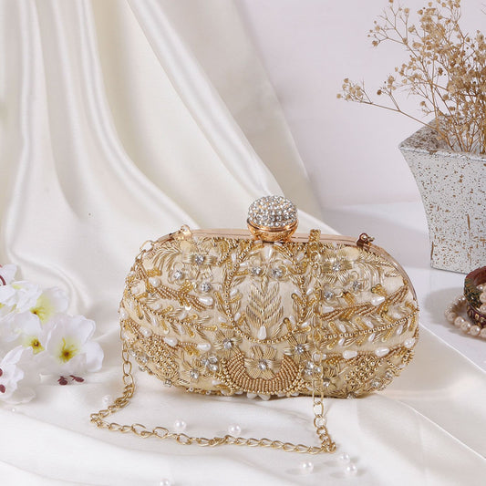 Golden oval clutch with beadwork & designer knob