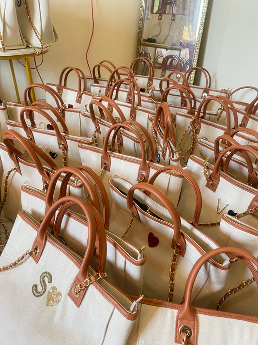 Beige canvas tote bag with crown charm