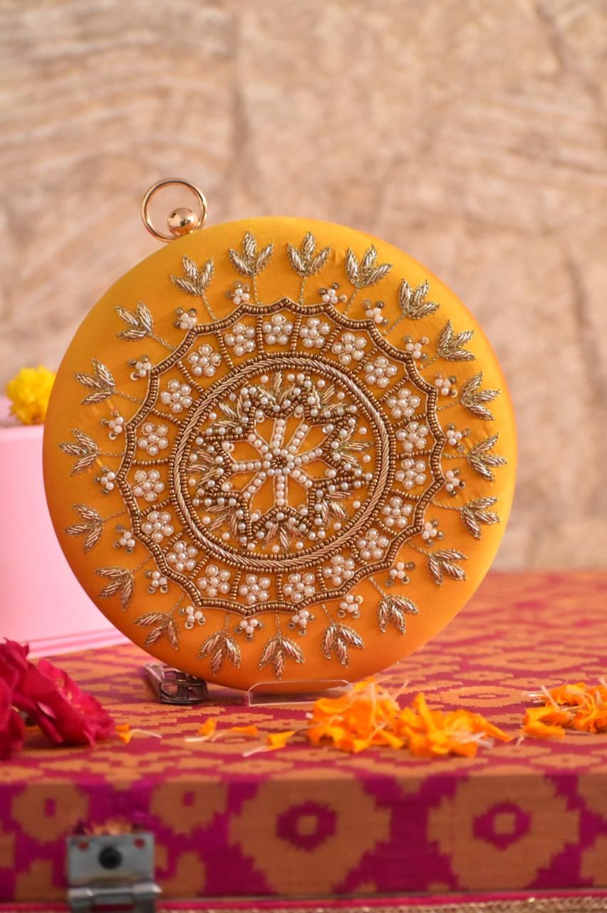 Yellow round clutch golden embroidery