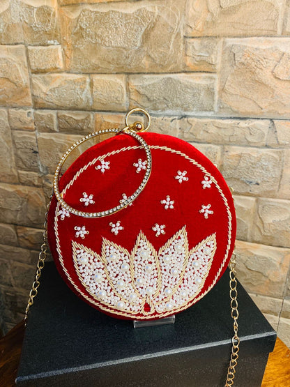 Red round clutch with white lotus beadwork with bangle