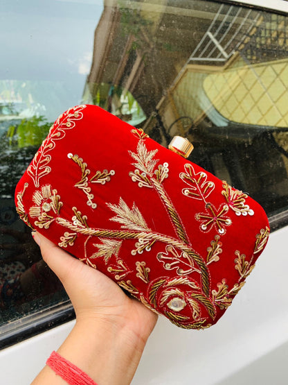 Velvet embroidered clutch with golden work