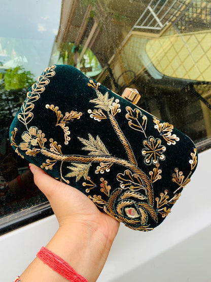 Velvet embroidered clutch with golden work