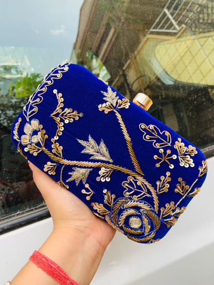 Velvet embroidered clutch with golden work