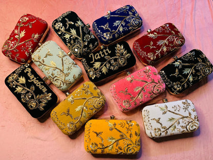 Velvet embroidered clutch with golden work