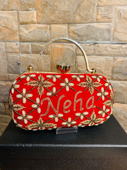 Oval embroidered clutch with golden handle & bead work