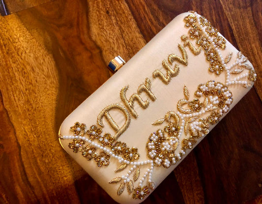 Embroidered clutch with golden piping work