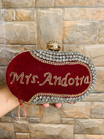 Maroon oval name clutch with stone work