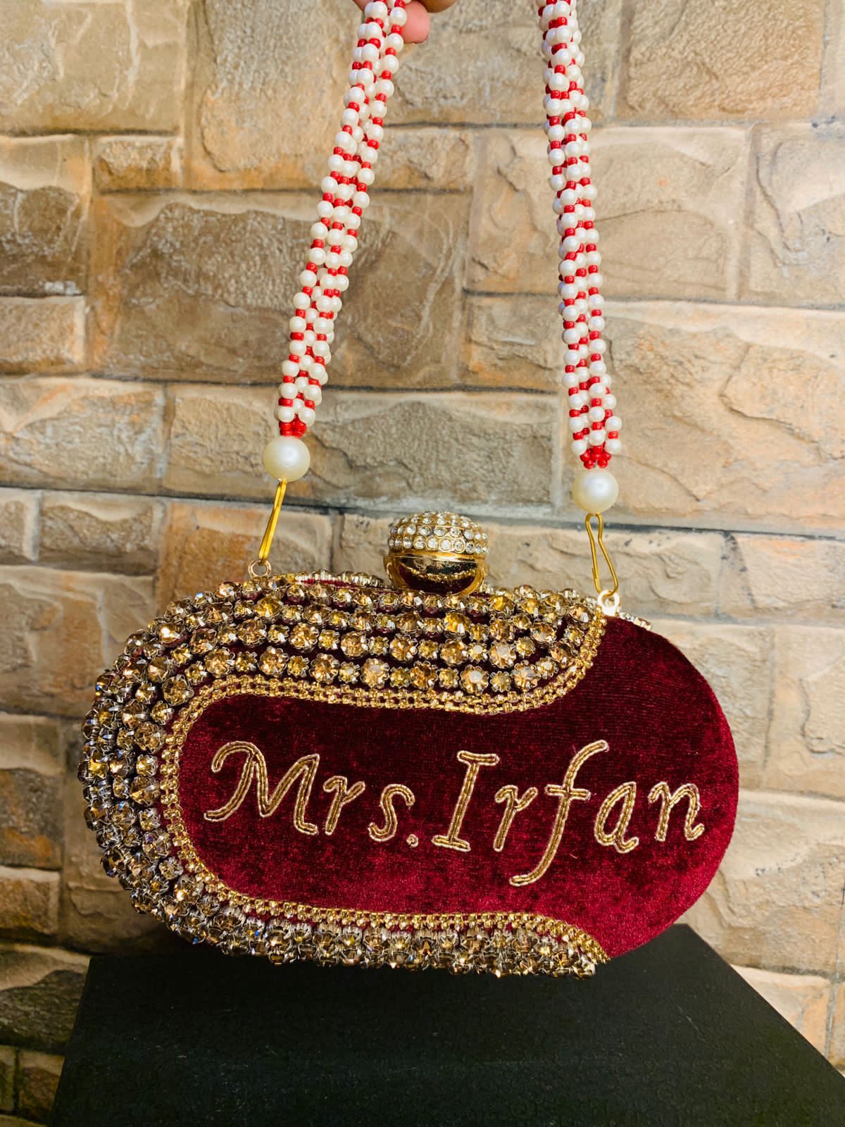 Maroon oval name clutch with stone work