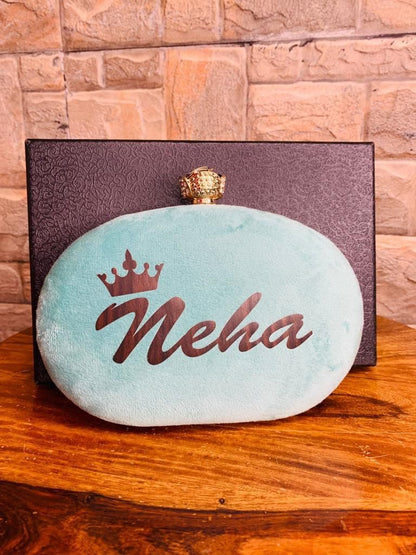 Oval name clutch with designer knob