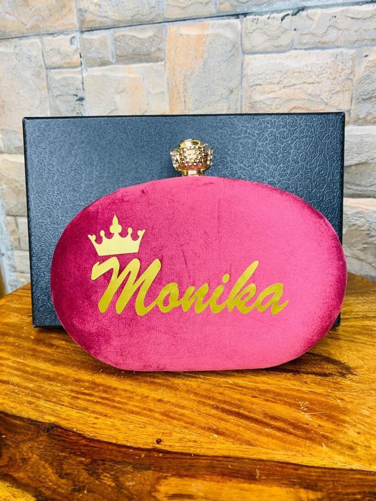 Oval name clutch with designer knob