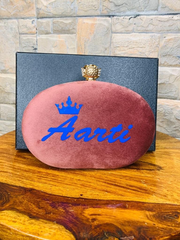 Oval name clutch with designer knob