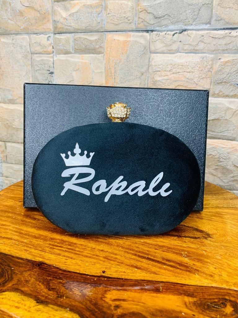 Oval name clutch with designer knob