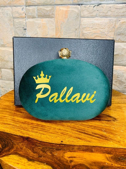 Oval name clutch with designer knob