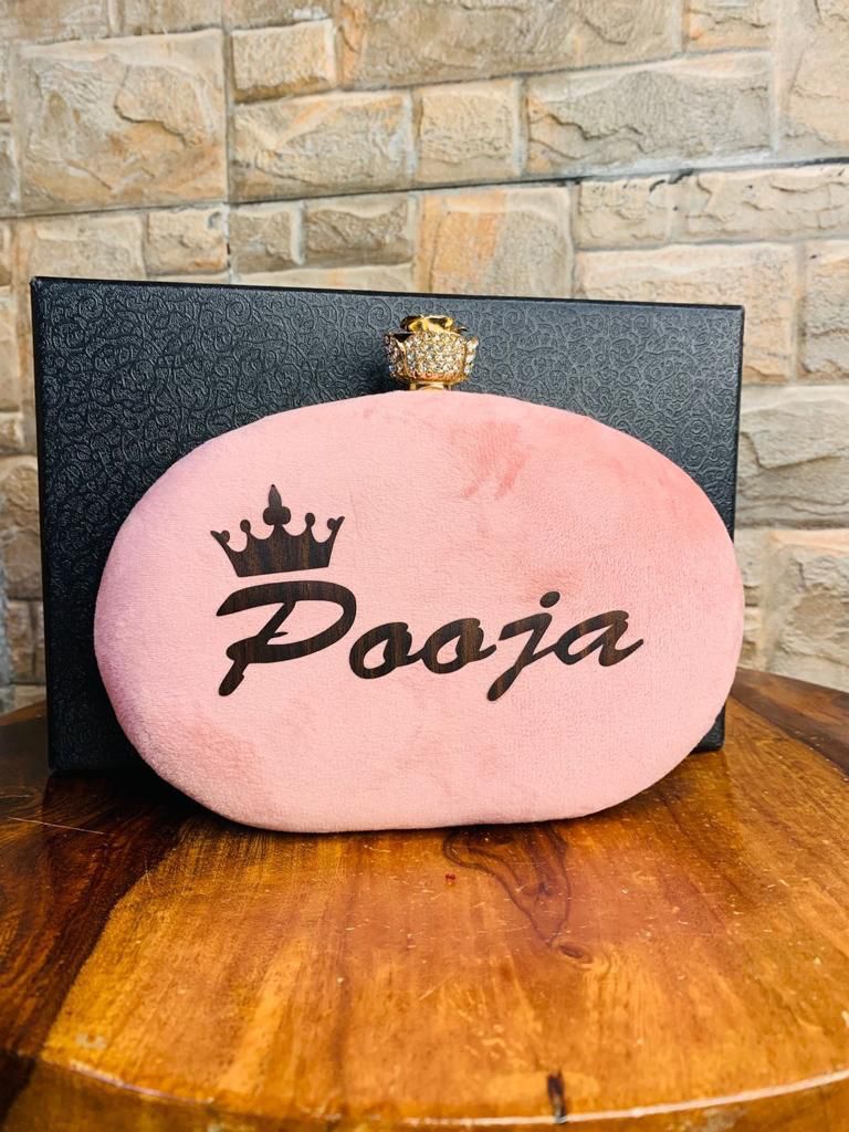 Oval name clutch with designer knob